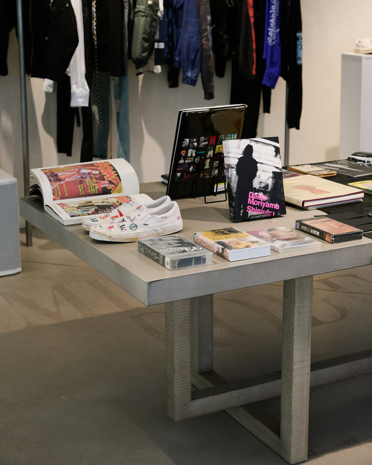 Art books and clothing inside the installation