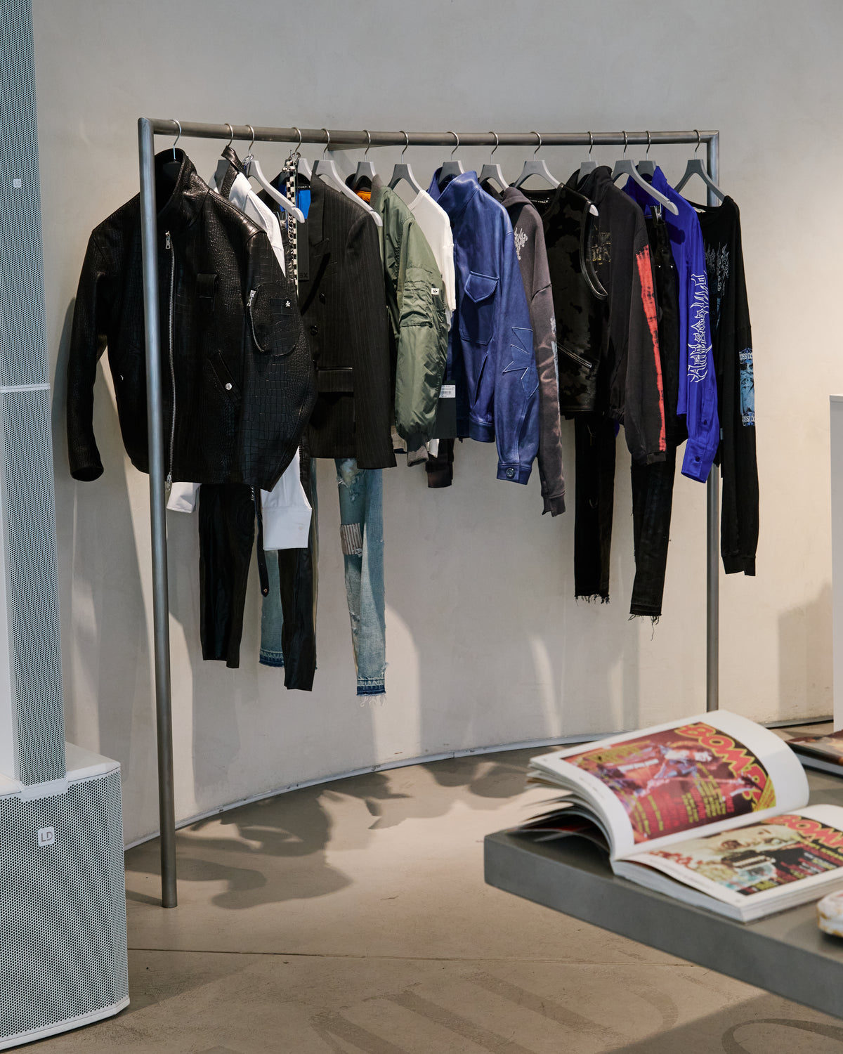Clothing and art books on display