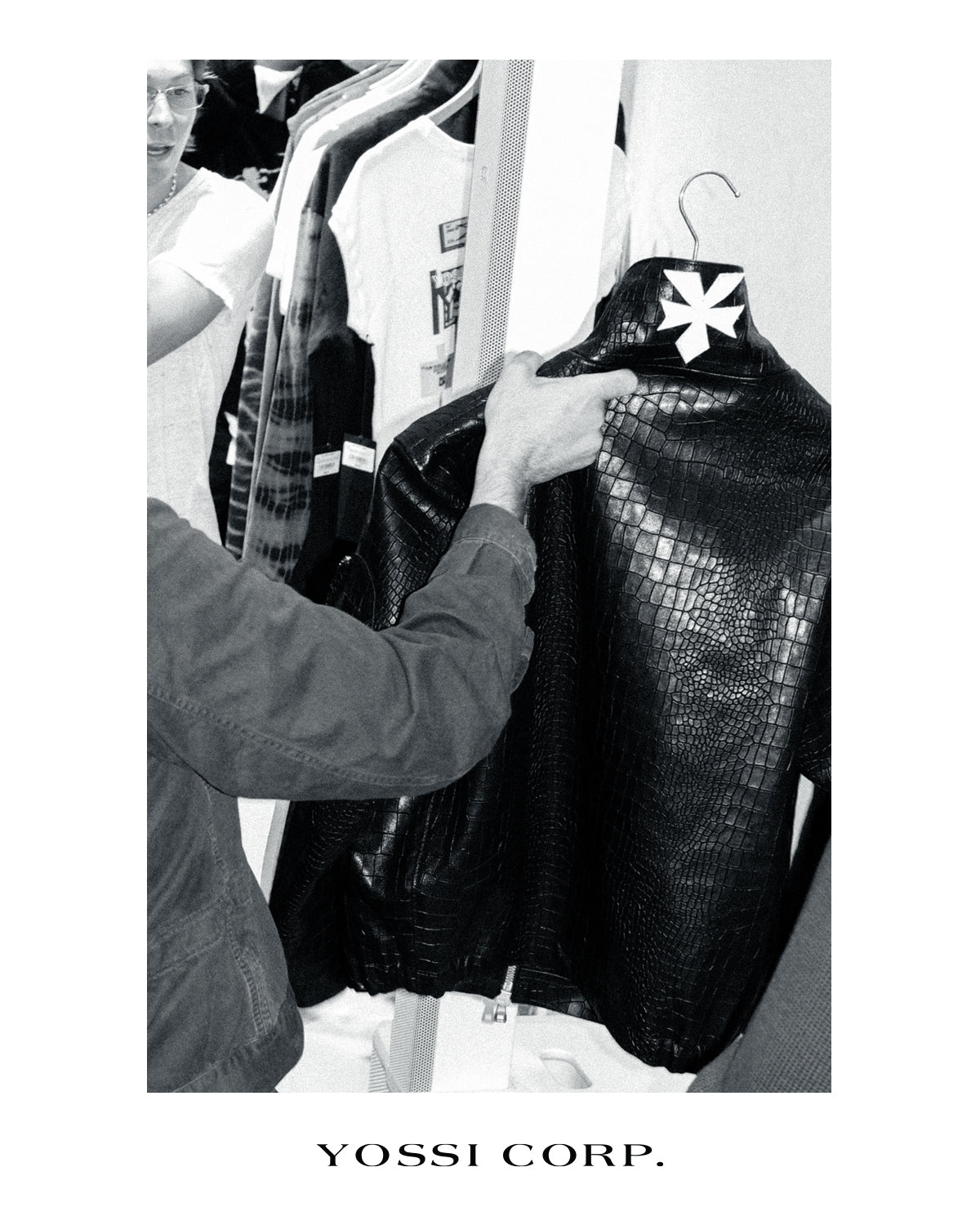Guest examining a textured black garment