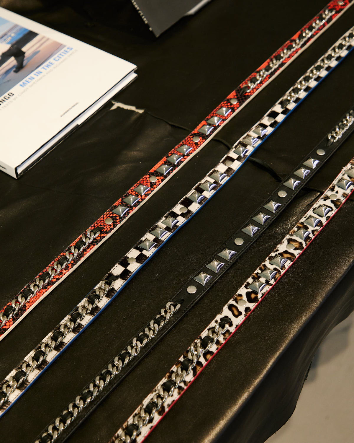 Patterned belts arranged on the display table